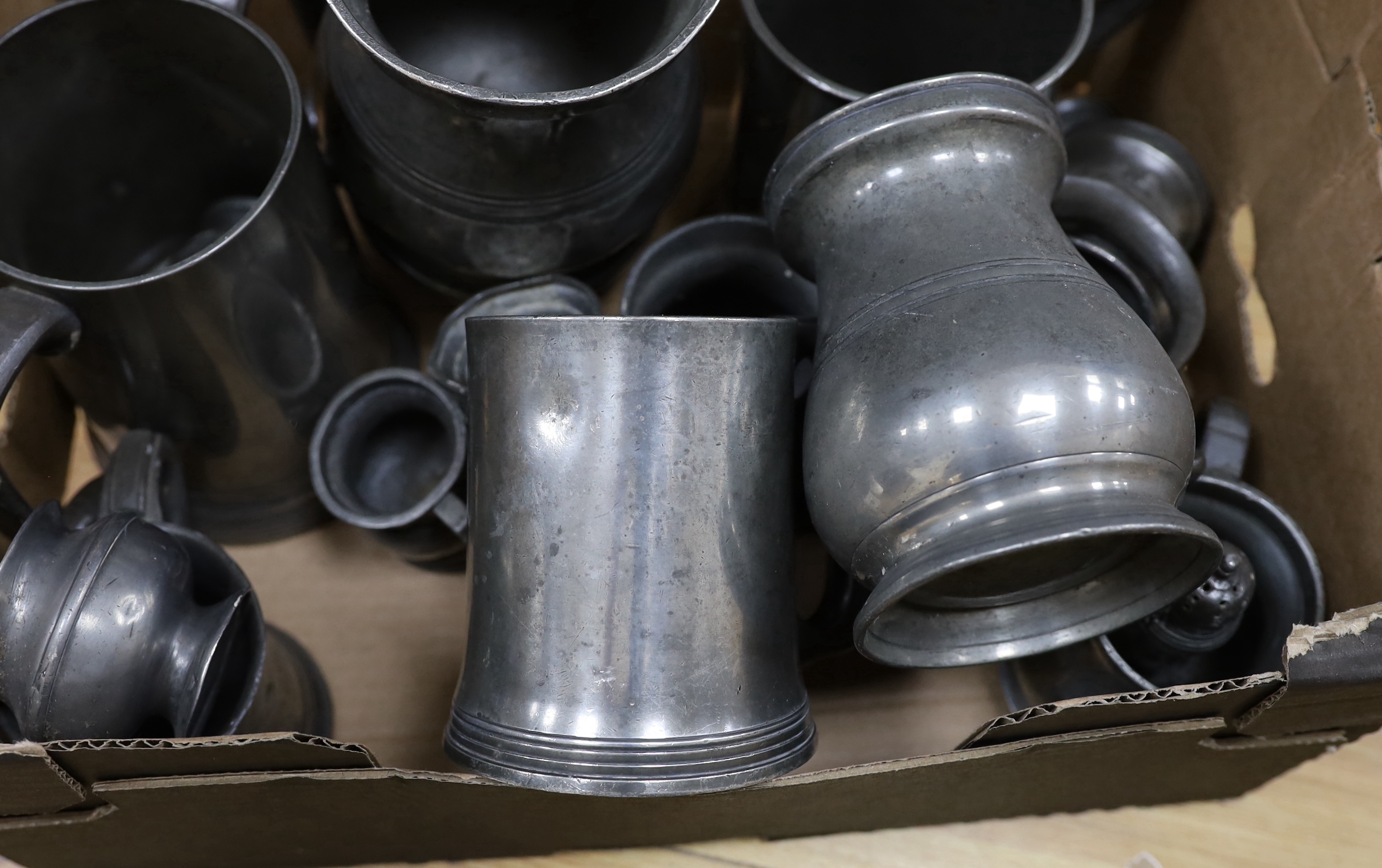 A collection of pewter mugs, largest 16cm high